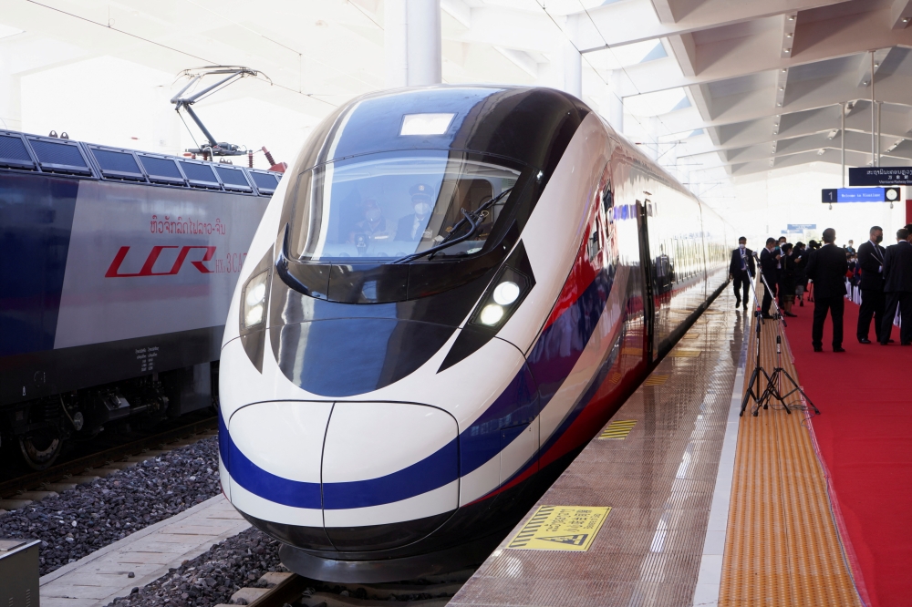 A train is ready on the station during the handover ceremony of the high-speed rail project linking the Chinese southwestern city of Kunming with Vientiane, in Vientiane, Laos, December 3, 2021. Reuters/Phoonsab Thevongsa/File Photo