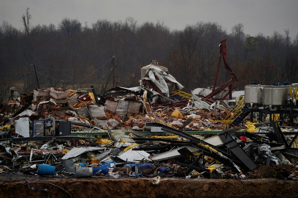 A general view of rubble and debris at the Mayfield Consumer Products candle factory in the aftermath of a tornado, after a devastating outbreak of tornadoes that ripped through several U.S. states, in Mayfield, Kentucky, U.S., December 16, 2021. REUTERS/Cheney Orr