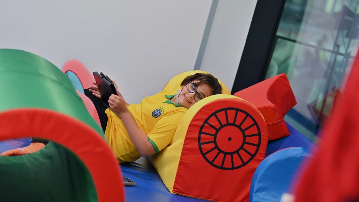 Young fans enjoy the sensory viewing room at Education City Stadium during the FIFA Arab Cup.