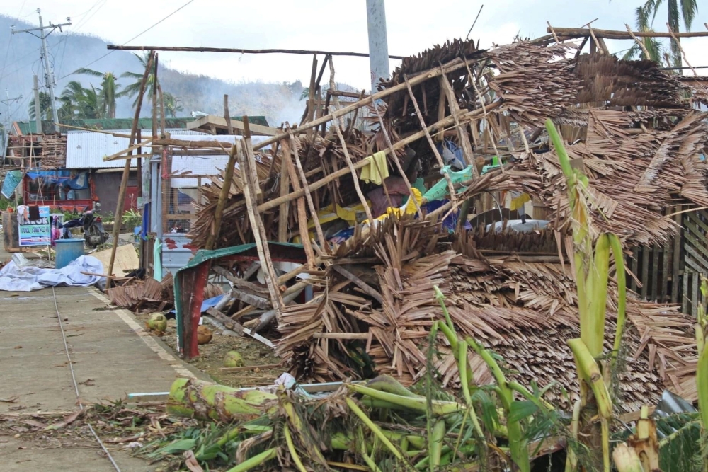 Houses damaged by typhoon Rai are seen, in Surigao del Norte province, Philippines, December 18, 2021. Philippine Coast Guard/Handout via Reuters 