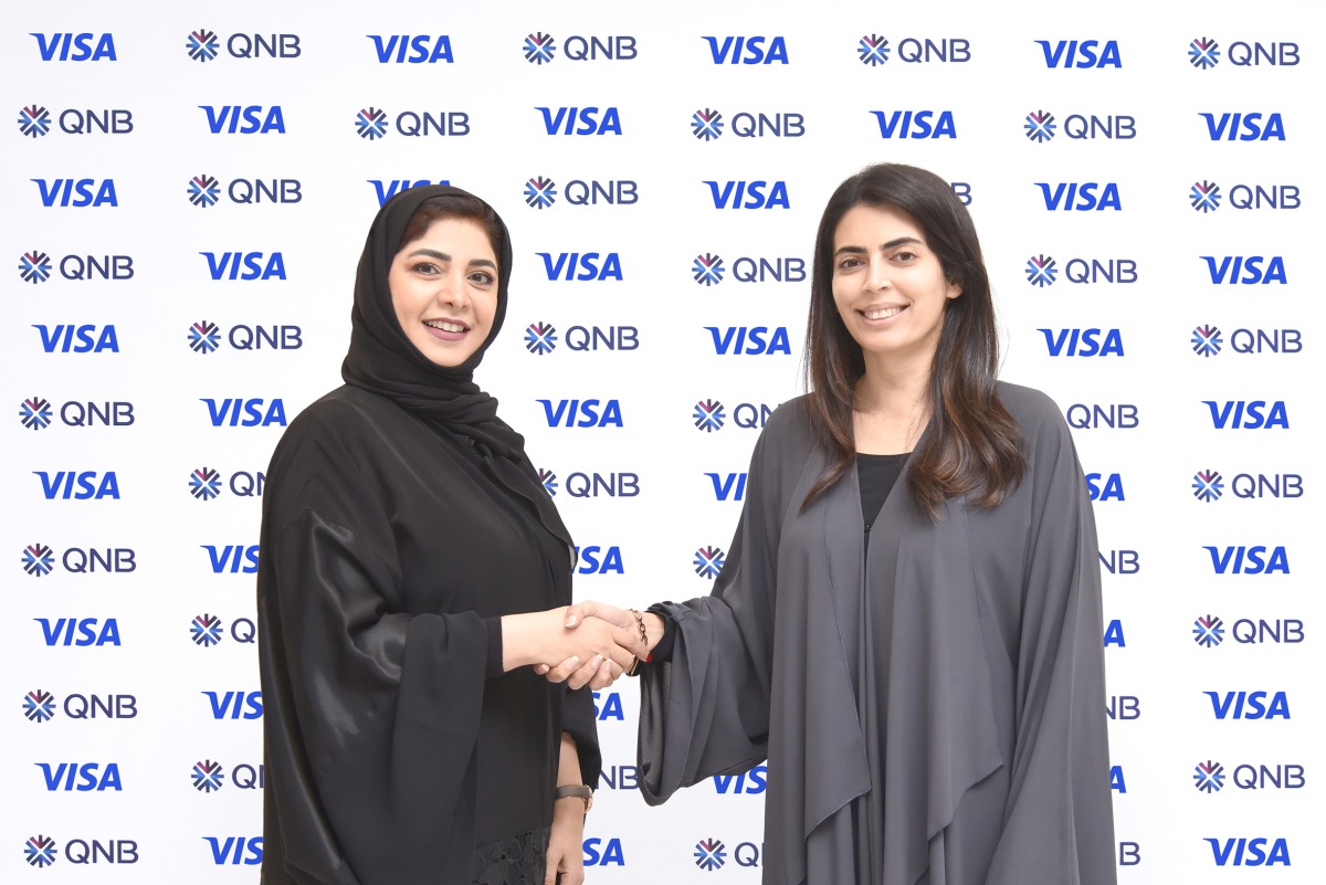 Heba Al Tamimi (left), GM Group Retail Banking at QNB with a Visa official in Doha, recently. 