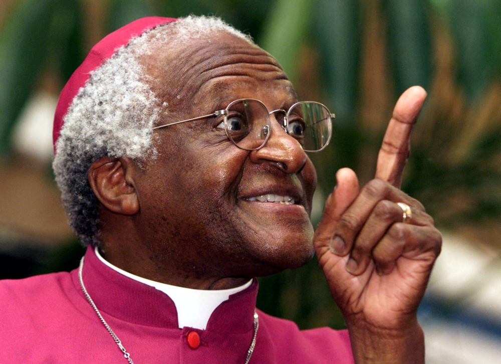 File photo of Archbishop Desmond Tutu as he makes a point addressing a meeting March 16, 2001 to raise awareness for World Tuberculosis Day. Reuters/Mike Hutchings/File Photo