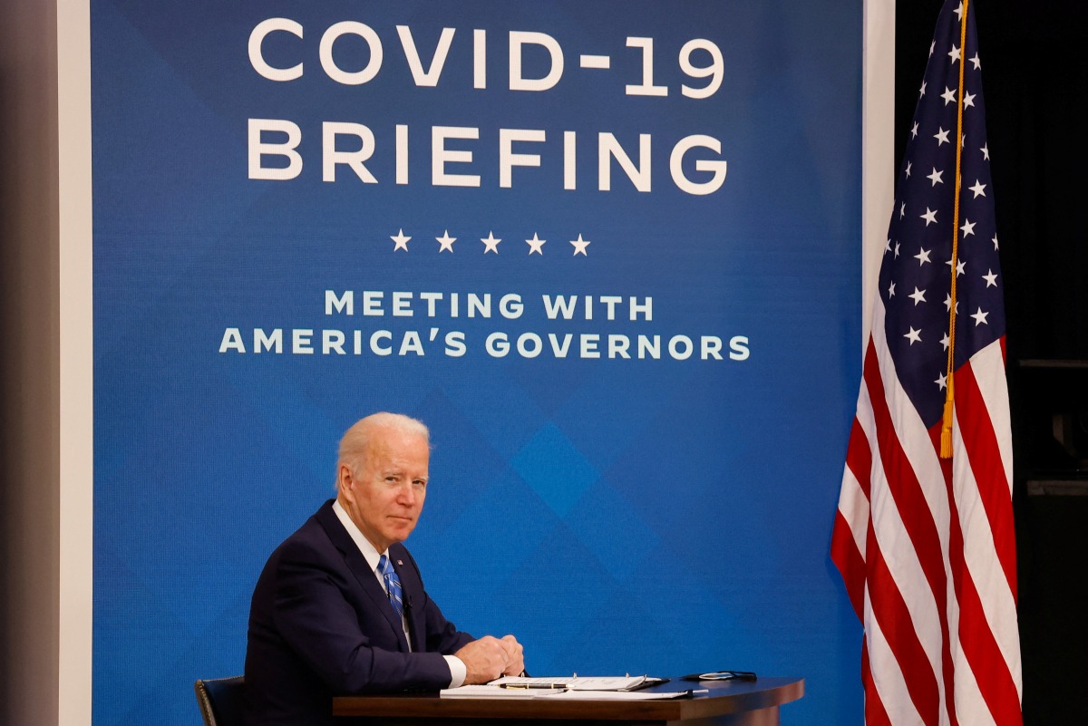 U.S. President Joe Biden and his COVID-19 Response Team hold their regular call with the National Governors Association to discuss his Administration's response to the Omicron variant and to hear from the Governors on the needs in their States, in the South Court Auditorium at the White House, in Washington, U.S., December 27, 2021. REUTERS/Evelyn Hockstein
