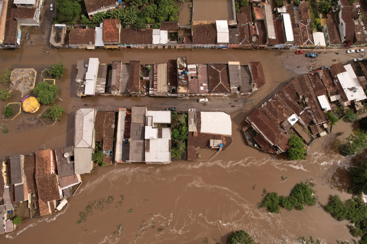 An aerial view shows flooded streets, caused due to heavy rains, in Itajuipe, Bahia state, Brazil December 27, 2021. Picture taken with a drone. REUTERS/Amanda Perobelli
