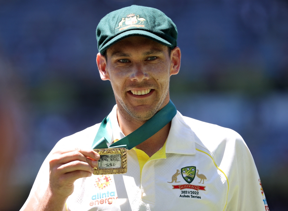 Australia's Scott Boland celebrates with the Mullagh Medal after winning the match and retaining the Ashes. Reuters/Loren Elliott