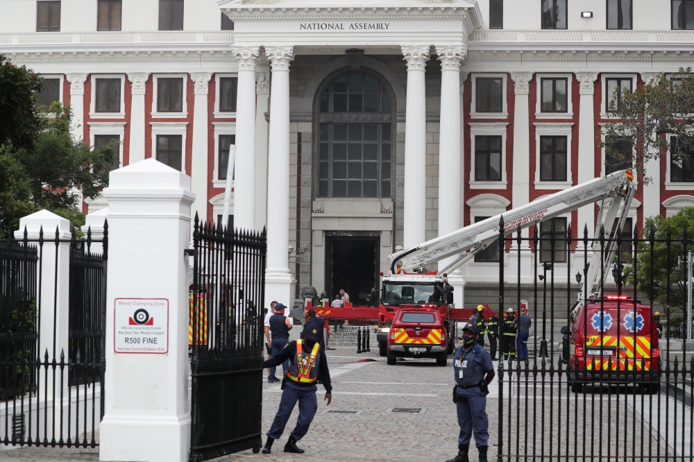 Firefighters work after a fire broke out in the Parliament in Cape Town, South Africa, January 2, 2022. Reuters/Sumaya Hisham