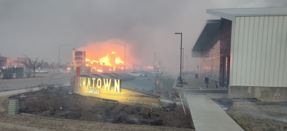 Wildfires are seen near the Tesla building in Boulder County in Colorado, U.S., December 30, 2021. Picture taken December 30, 2021 in this still image obtained from social media. Instagram@sunshinefire.boulder.colorado/via REUTERS