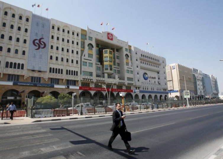 A file photo of a man walking across the Grand Hamad Street, also known as the ‘Bank Street’ in Doha.