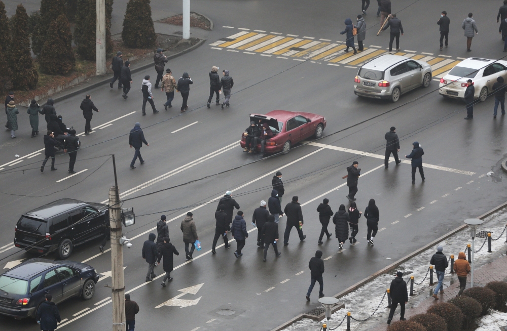 Demonstrators walk along a street during a protest triggered by fuel price increase in Almaty, Kazakhstan January 5, 2022. Reuters/Pavel Mikheyev