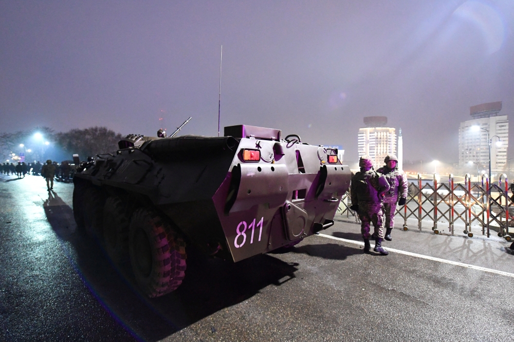 An armoured personnel carrier is seen near the mayor's office during protests triggered by fuel price increase in Almaty, Kazakhstan January 5, 2022. REUTERS.