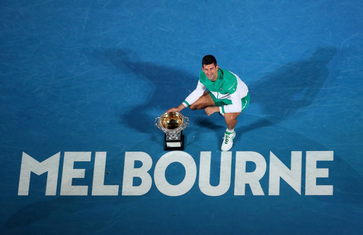 FILE PHOTO: Serbia's Novak Djokovic celebrates with the trophy after winning his final match against Russia's Daniil Medvedev REUTERS/Kelly Defina/File Photo
