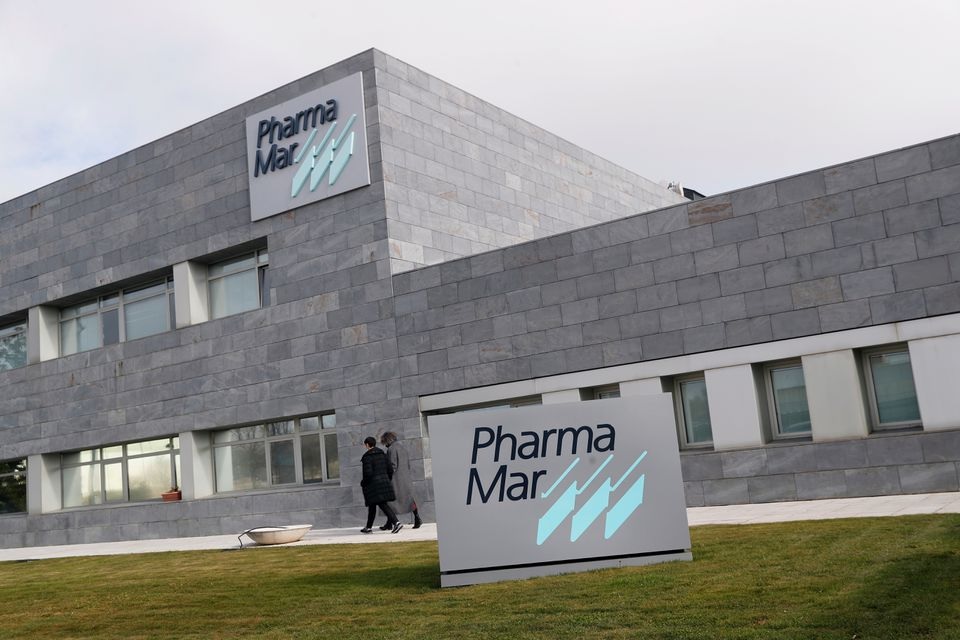 Workers walk outside the Spanish pharmaceutical company PharmaMar, amid the coronavirus disease (COVID-19) outbreak, in Colmenar Viejo, Spain January 26, 2021. REUTERS/Susana Vera

