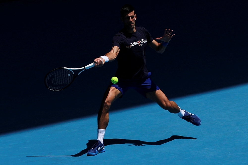 Serbian tennis player Novak Djokovic practices at Melbourne Park as questions remain over the legal battle regarding his visa to play in the Australian Open in Melbourne, Australia, January 12, 2022. Reuters/Loren Elliott