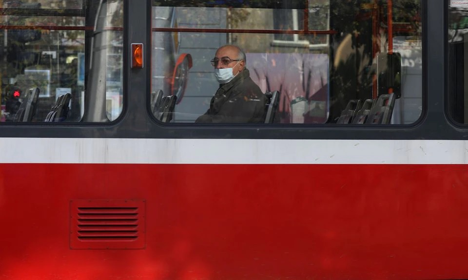 A man, wearing protective face mask rides on a train, amid the spread of the coronavirus disease (COVID-19), in Sofia, Bulgaria, October 27, 2020. REUTERS/Stoyan Nenov

