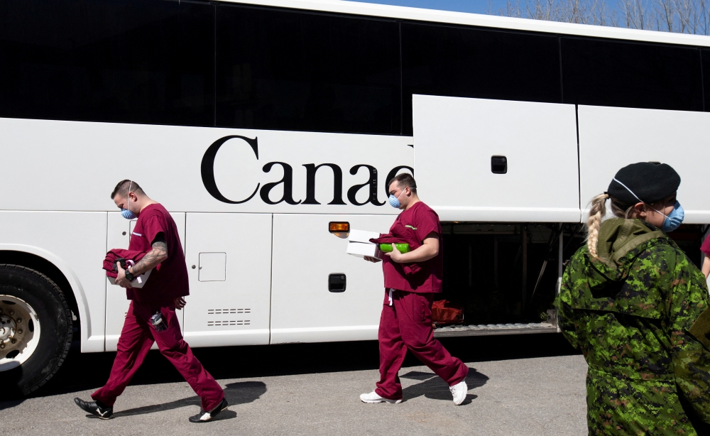 A bus carrying Canadian Armed Forces (CAF) medical personnel arrives at Villa Val des Arbres, a seniors' long-term care centre, to help amid the outbreak of the coronavirus disease (COVID-19), in Montreal, Quebec, Canada April 20, 2020. Reuters/Christinne Muschi/File Photo
