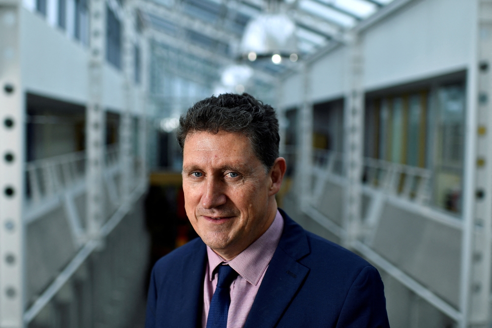 Ireland's Minister for Transport, Climate, Environment and Communications Eamon Ryan poses for a photograph after an interview with Reuters in his office, ahead of his trip to COP26, in Dublin, Ireland, October 28, 2021. REUTERS/Clodagh Kilcoyne/File Photo
