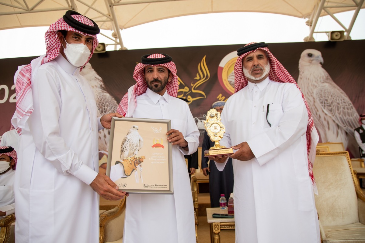 Chief of Special Amiri Diwan H E Khalid bin Shaheen bin Ghanim Al Ghanim receiving a commemorative shield during his visit to Marmi Festival at Sabkhat Marmi in Sealine.