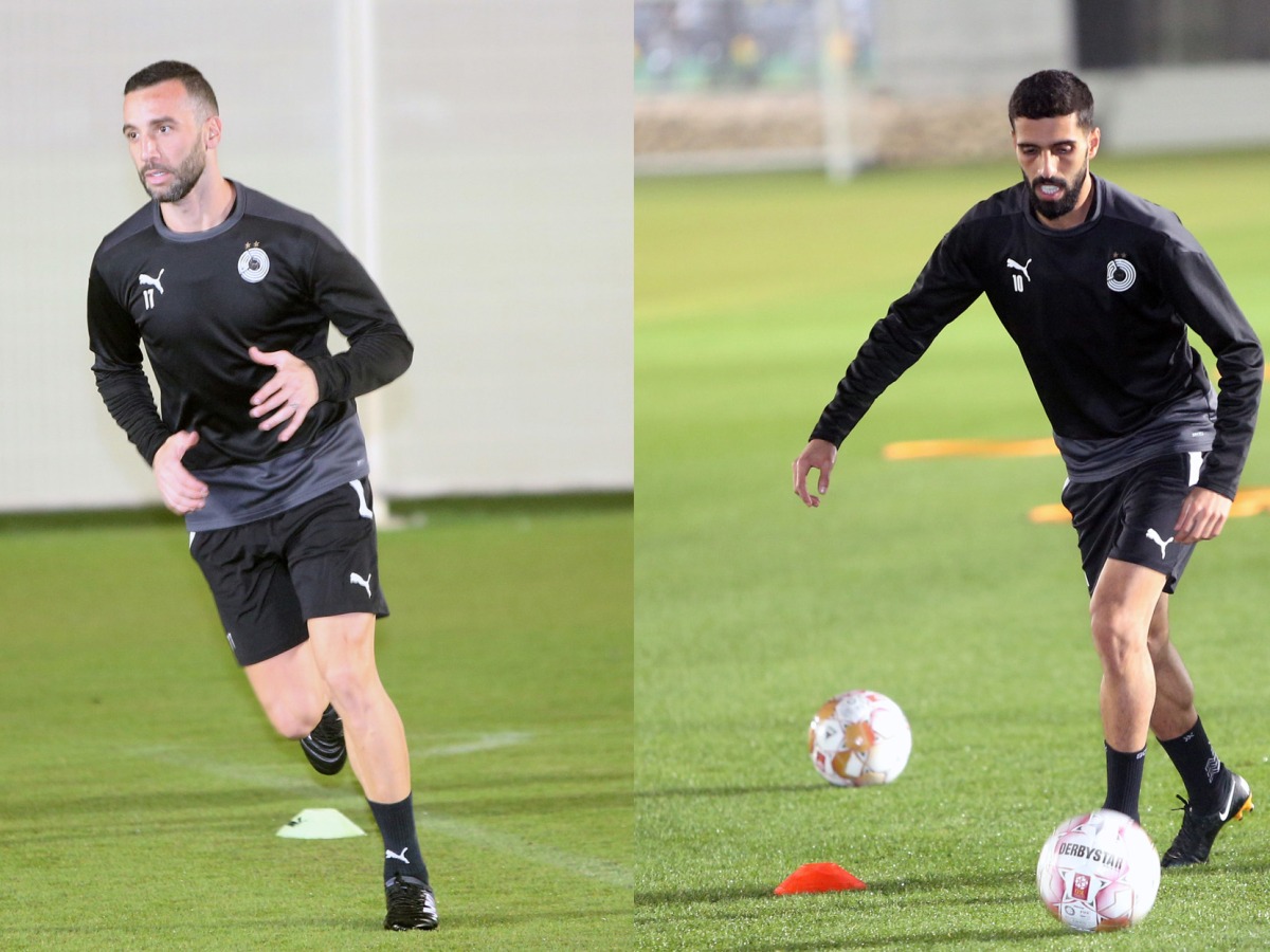 Al Sadd's Guilherme dos Santos Torres and Hassan Al Haydos during a training session, yesterday. 