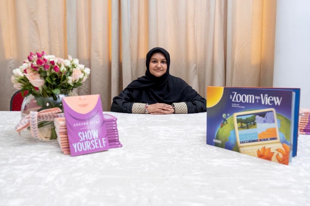 Adeeba Jafri poses with some of her books. 