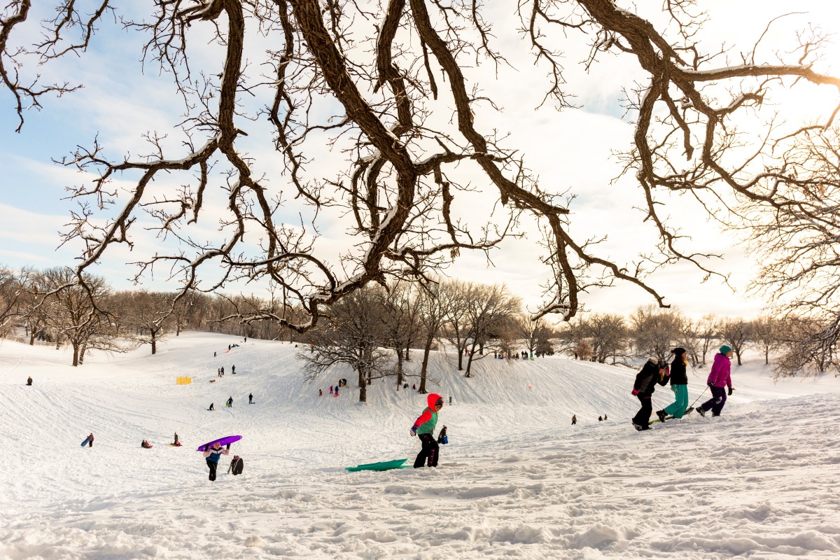 Children sled at Waveland Golf Course after the area accumulated snow from Winter Storm Izzy in Des Moines, Iowa, U.S., January 15, 2022. REUTERS/Rachel Mummey
