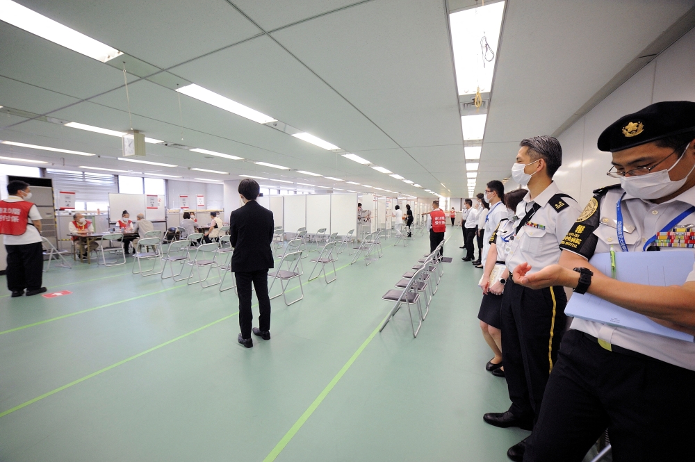 A member of Japan Self-Defense Forces is seen at a mass vaccination coronavirus disease (COVID-19) site in Tokyo, Japan June 9, 2021. David Mareuil/Pool via REUTERS/File Photo