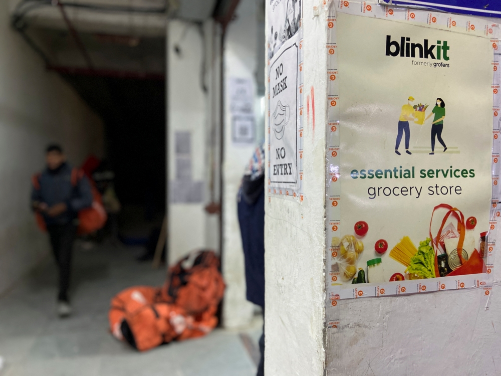 A delivery person leaves a dark store of the SoftBank-funded Blinkit in New Delhi, India, January 19, 2022. Reuters/Anushree Fadnavis