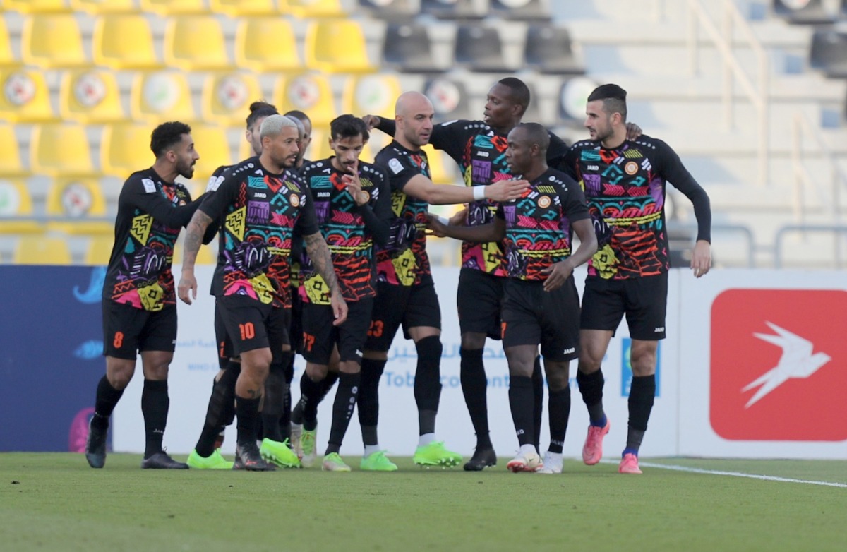 Umm Salal players celebrate after Aymen Hussein scored their second goal against Al Shamal, yesterday.