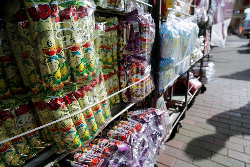 Several flavours of 'Umaibo', a popular Japanese corn snack, are displayed at a confectionery wholesaler's in Tokyo, Japan January 25, 2022. Picture taken January 25, 2022. REUTERS/Akira Tomoshige
