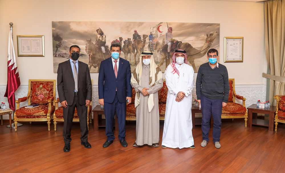 Secretary-General of Qatar Red Crescent Society Ali bin Hassan Al Hammadi and Ambassador of Yemen to Qatar H E Rajeh Hussen Badi with other official during a meeting.