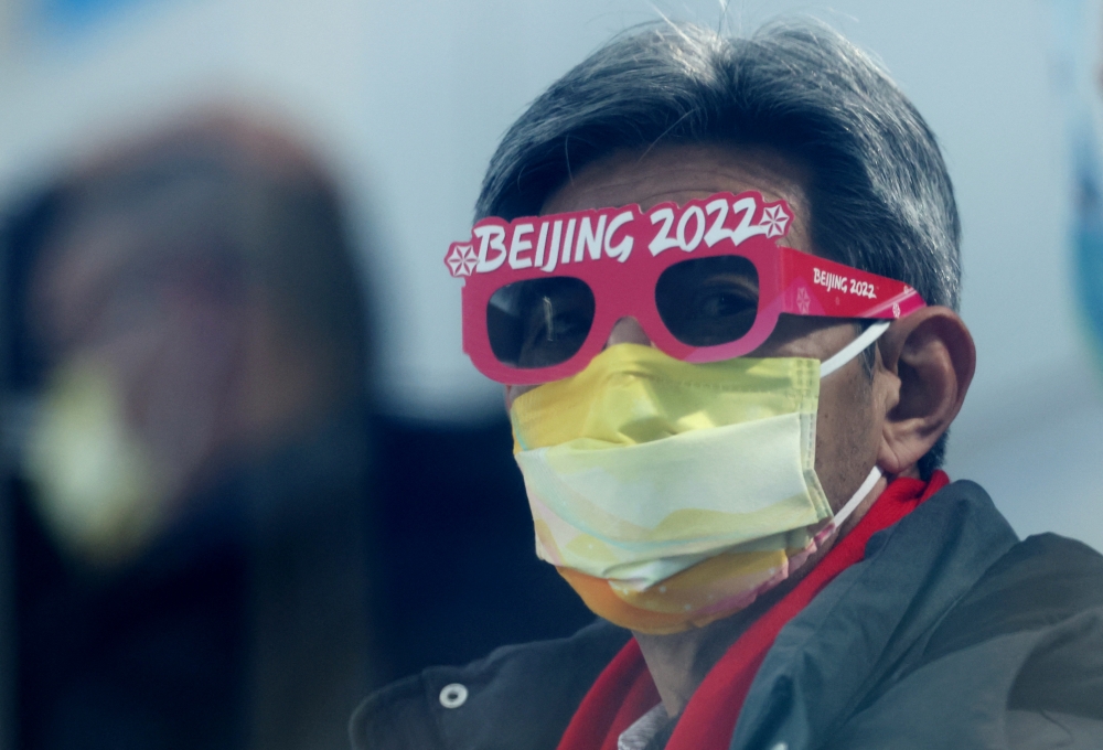 A spectator in the crowd before the race. Reuters/Phil Noble