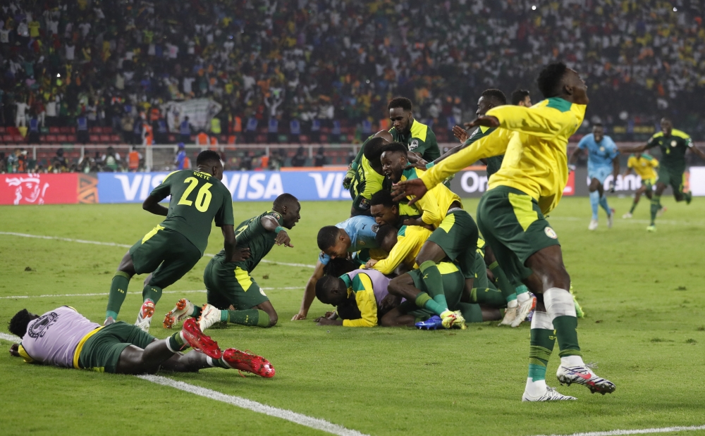 Senegal players celebrate winning the penalty shoot out REUTERS/Mohamed Abd El Ghany