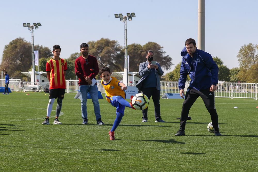 A child joins in a football game organised by the Aspire Zone Foundation at the Aspire Park.
