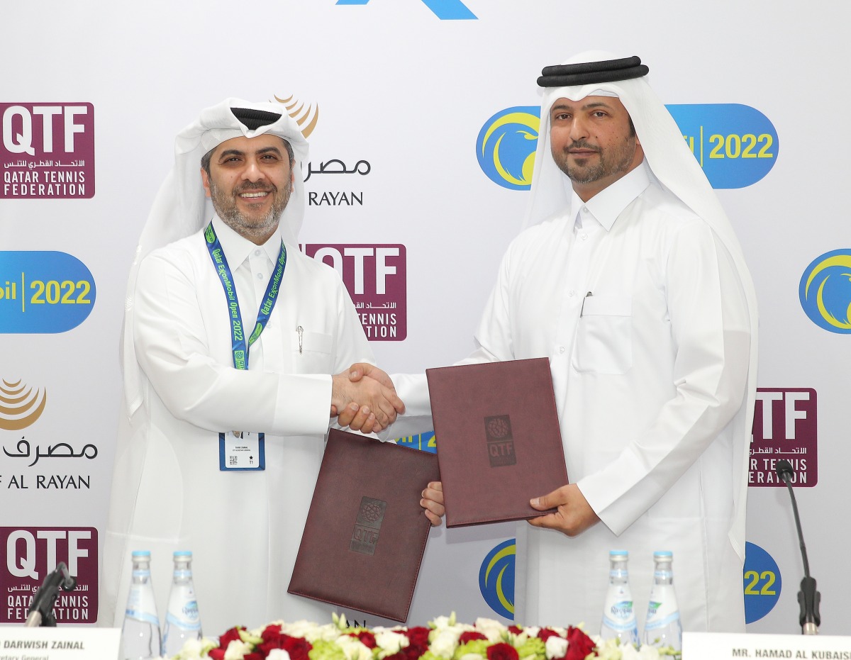 Qatar Tennis, Squash and Badminton Federation's Secretary General Tariq Darwish Zainal and Masraf Al Rayan's Group Chief of Human Resources Hamad Al Kubaisi shake hands during the sponsorship agreement signing ceremony, yesterday. Pic: Salim Matramkot/The Peninsula