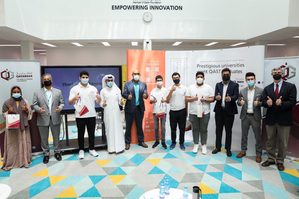 Qatargas officials with students who attended the workshop.
