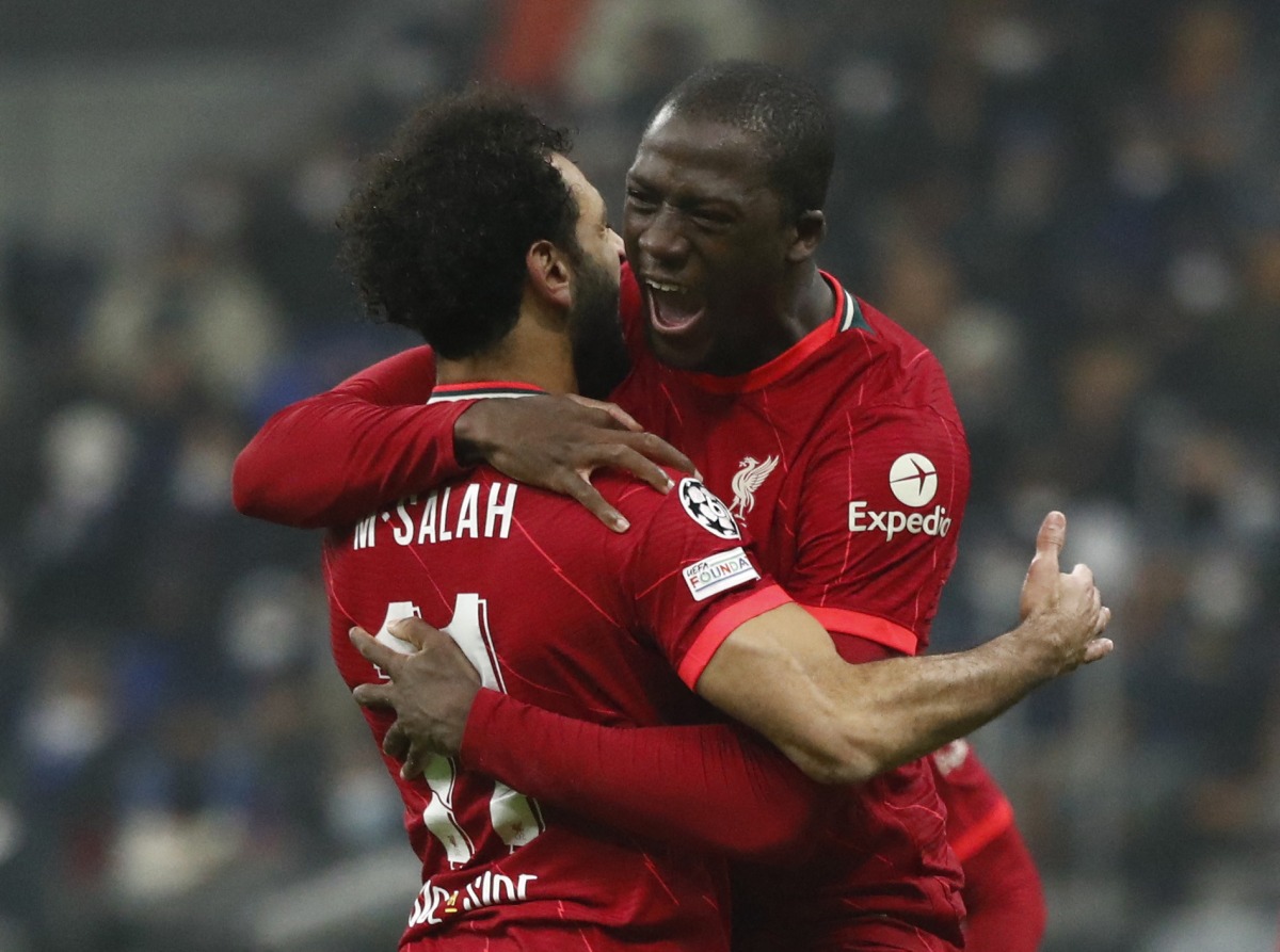 Mohamed Salah celebrates with team-mate Ibrahima Konate after scoring Liverpool’s second goal against Inter Milan, yesterday.