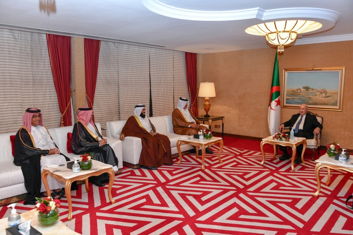 President of Algeria H E Abdelmadjid Tebboune with QC First Vice-Chairman Mohamed bin Towar Al Kuwari and other officials during a meeting, yesterday.  