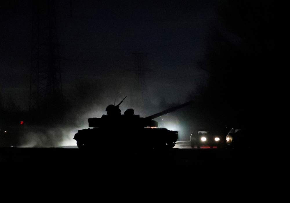 A tank drives along a street in eastern Ukraine following the recognition of their independence, in the separatist-controlled city of Donetsk, Ukraine February 22, 2022. Reuters/Alexander Ermochenko