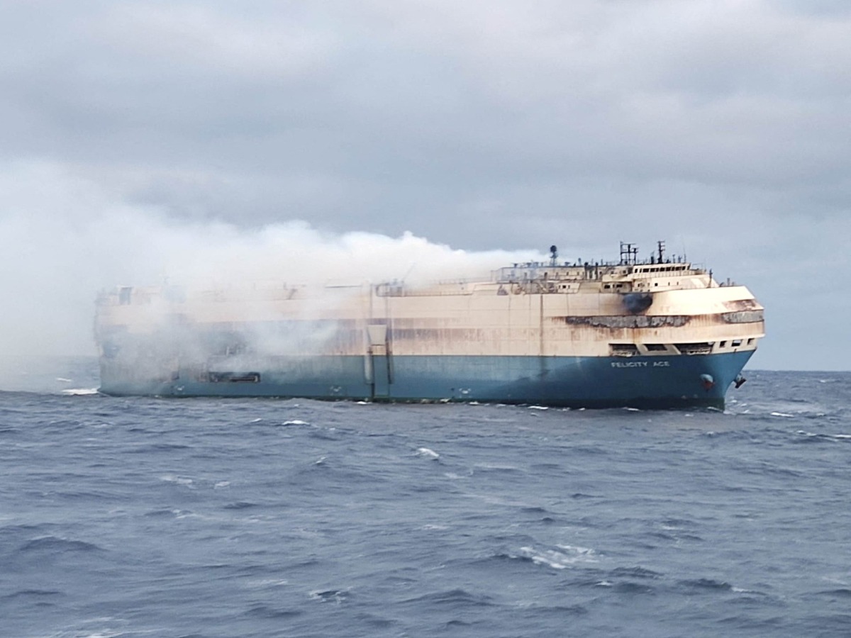 FILE PHOTO: The ship, Felicity Ace, which was traveling from Emden, Germany, where Volkswagen has a factory, to Davisville, in the U.S. state of Rhode Island, burns more than 100 km from the Azores islands, Portugal, February 18, 2022. Portuguese Navy (Marinha Portuguesa)/Handout via REUTERS THIS IMAGE HAS BEEN SUPPLIED BY A THIRD PARTY./File Photo
