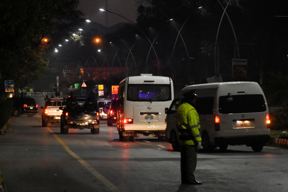Vehicles carrying the Australian cricket team, who are on their first tour of Pakistan in 24 years, pass by in Islamabad, Pakistan, February 27, 2022. Reuters/Waseem Khan 