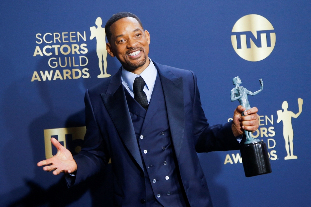 Actor Will Smith poses backstage with his awards for Outstanding Performance by a Male Actor in a Leading Role at the 28th Screen Actors Guild Awards, in Santa Monica, California, U.S., February 27, 2022. Reuters/Aude Guerrucci