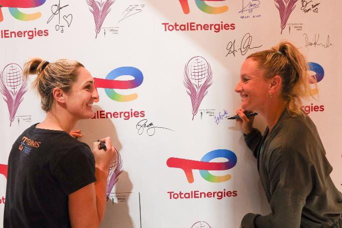 Doubles Players Gabriela Dabrowski and Emily Webley Smith engage in interviews and signatures at the TotalEnergies booth. 