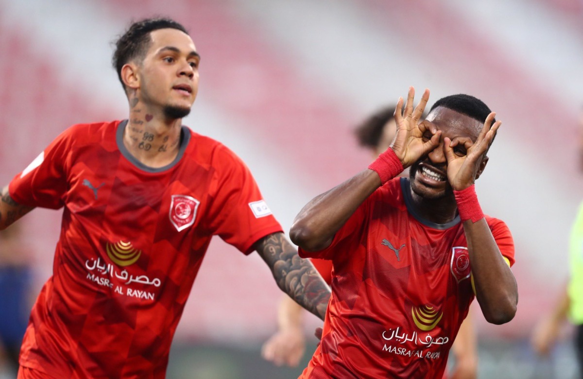 Al Duhail's Ismail Mohamed celebrates with team-mate Edmilson Jr. after scoring their second goal against Al Sailiya, yesterday. 