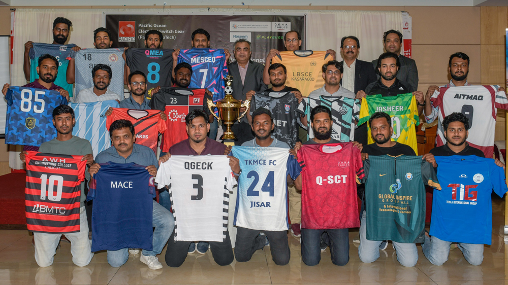 Players displaying their jersey and the trophy of this year’s tournament