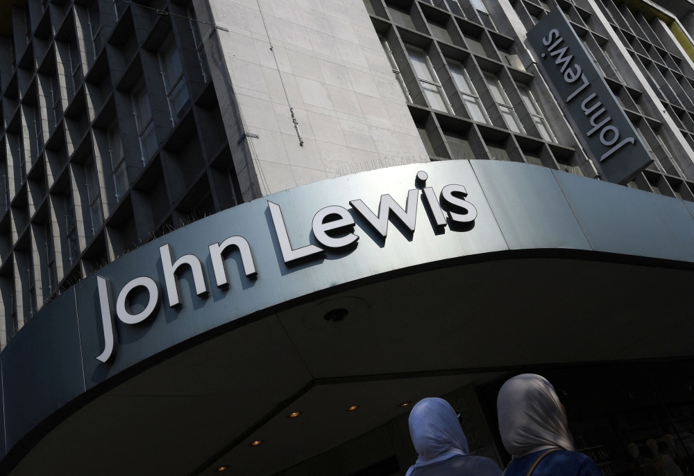 Shoppers pass a branch of John Lewis in London, Britain, September 15, 2016. REUTERS/Toby Melville/File Photo