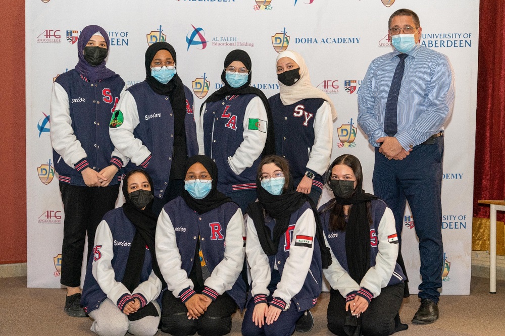 Doha Academy students with school officials.