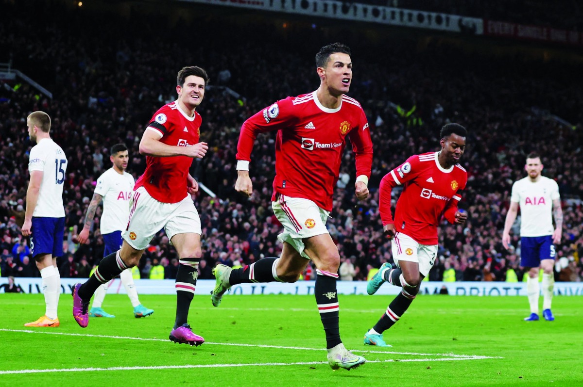 Cristiano Ronaldo celebrates after scoring their third goal.