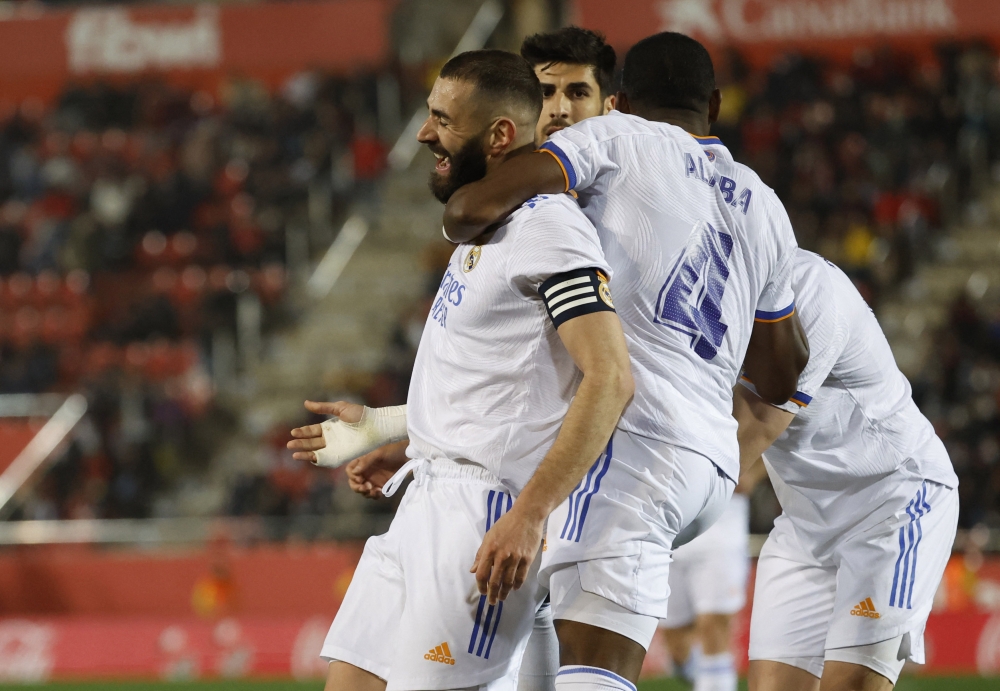 Real Madrid's Karim Benzema celebrates scoring their third goal with David Alaba REUTERS/Juan Medina
