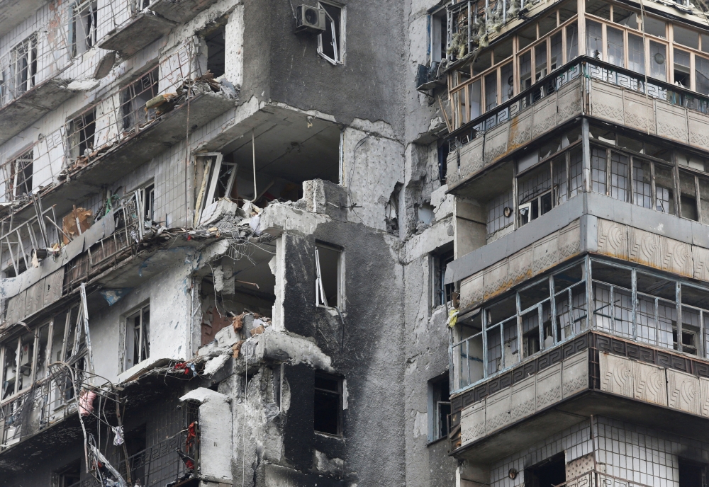 A view shows a residential building which was damaged during Ukraine-Russia conflict in the besieged southern port city of Mariupol, Ukraine March 18, 2022. REUTERS.
