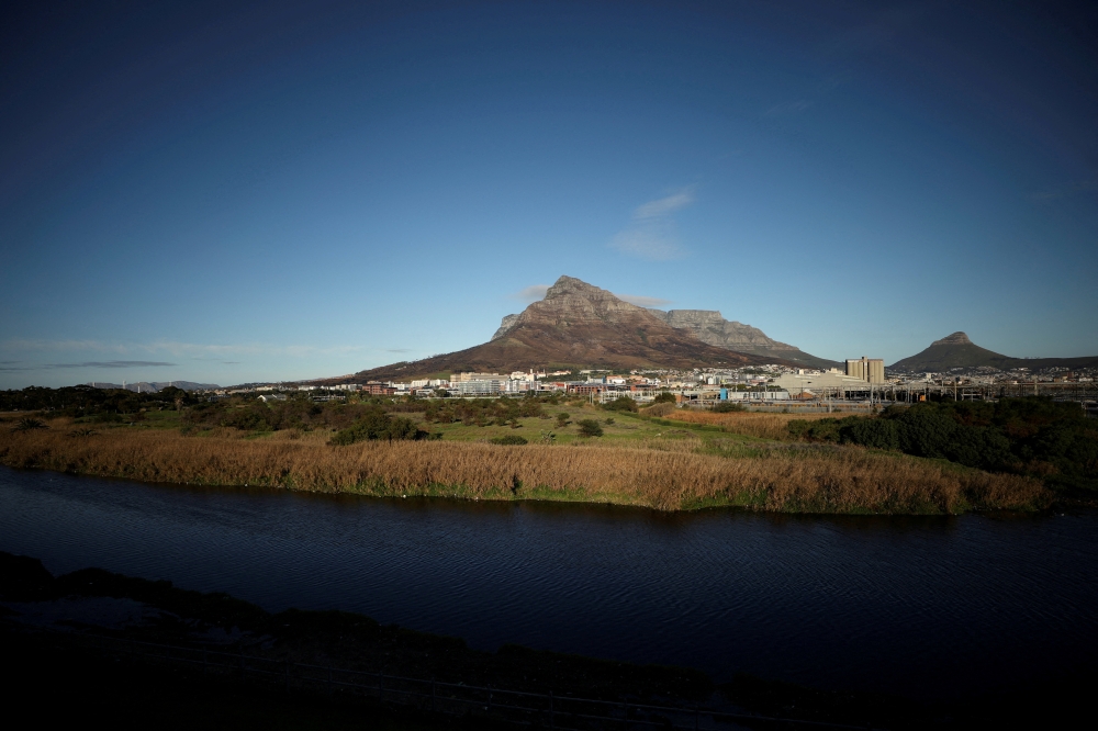 Contested land earmarked for a development which includes a new Africa headquarters for Amazon is seen alongside the Black River in Cape Town, South Africa, June 2, 2021. Picture taken June 2, 2021. REUTERS/Mike Hutchings/File Photo