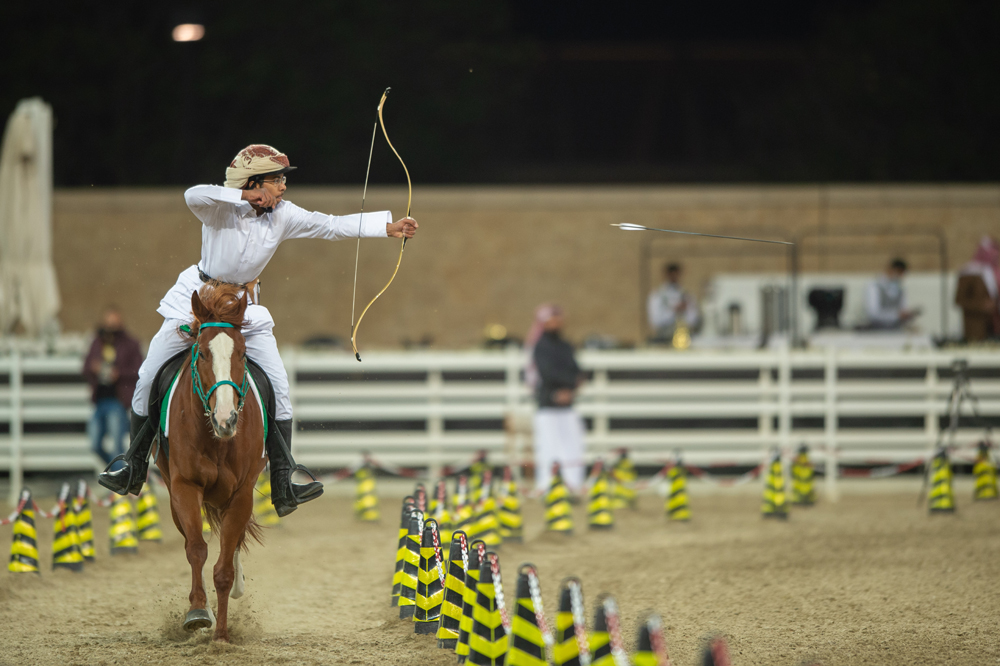 An archer in action during the second Al Nashaab Horseback Archery Championship.